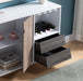 Giga wooden wine cabinet with drawer and display rack holding six wine glasses in white and dark taupe finish.