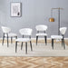 Set of four Giga minimalist ergonomic dining chairs with curved backs, modern design, and sleek wooden legs.