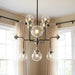HomeRoots Sputnik eight-light metal chandelier with black and white shades, modern lighting fixture with a sleek design.