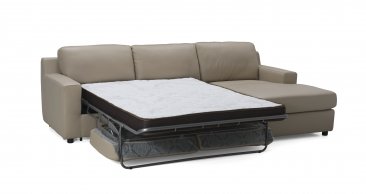 Jenny Premium Leather Sectional Sleeper in Beige In Right Or Left Hand Facing Chaise.