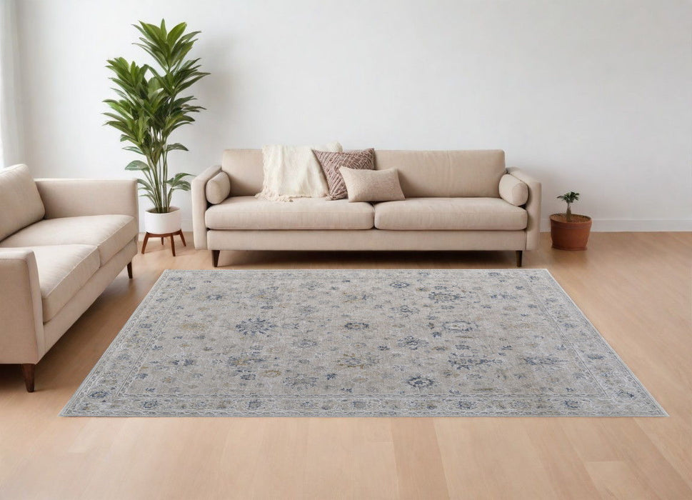 6.6' x 9.5' Floral Power Loom Worn Faded Area Rug With Fringe - Ivory Taupe And Blue