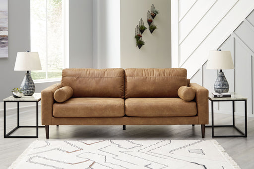 Signature Design by Ashley Telora caramel stationary sofa with plush upholstery and wide armrests, showcasing a modern living room style.