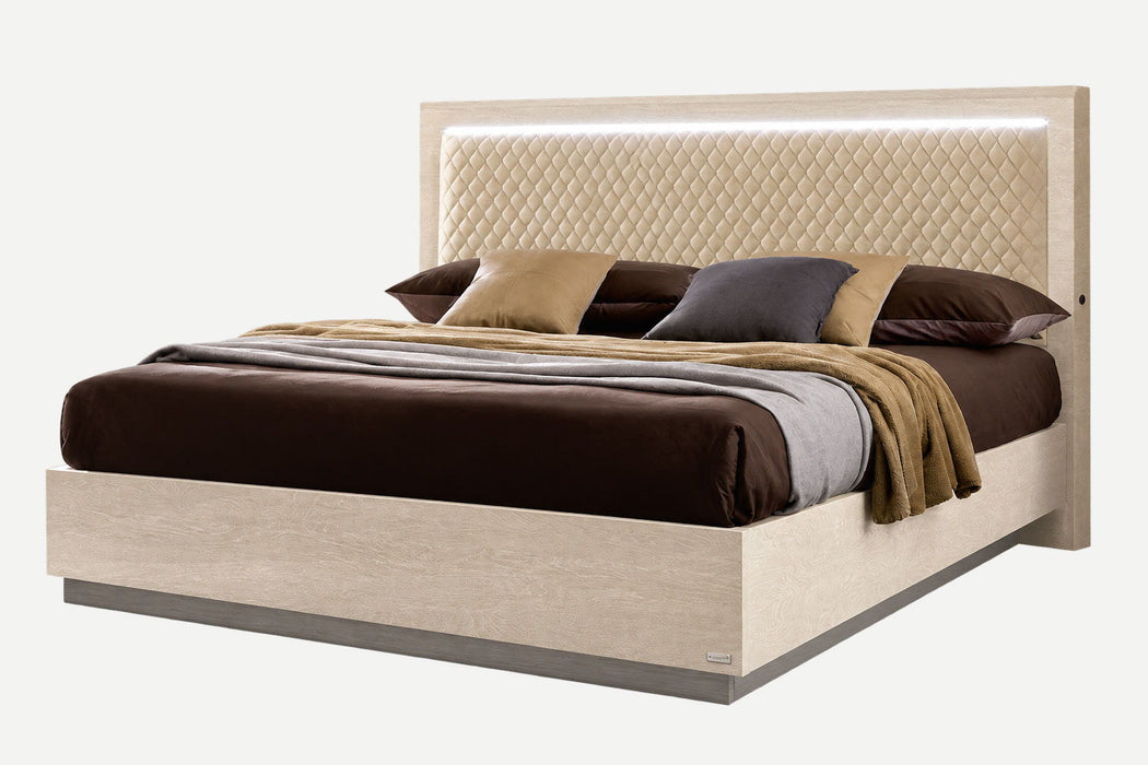 Light beige Ambra Rombi Queen Size upholstered bed by Camelgroup Italy with a padded headboard and modern design.