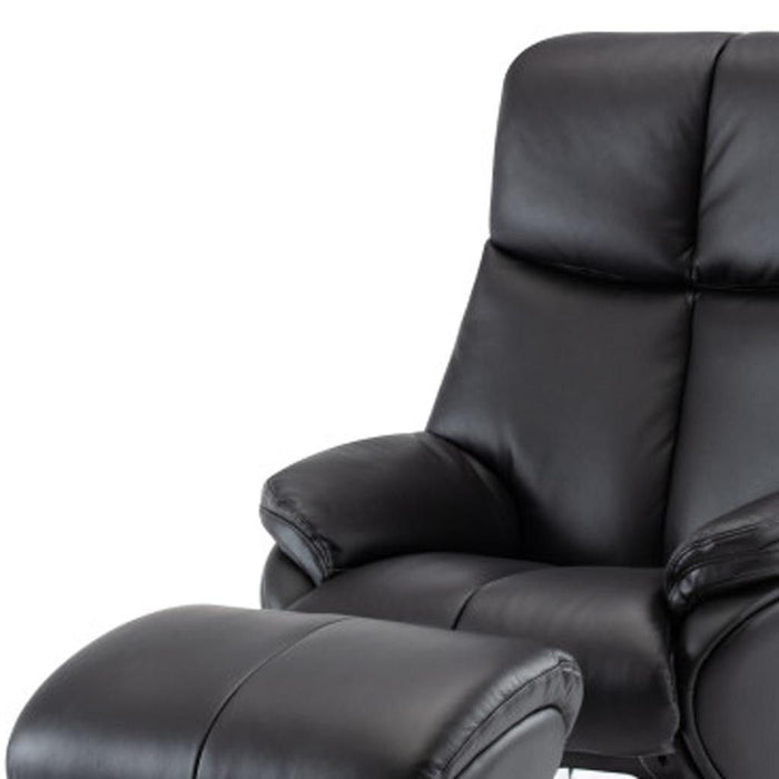 Black genuine leather HomeRoots tufted swivel recliner with matching ottoman, featuring a padded backrest and armrests.