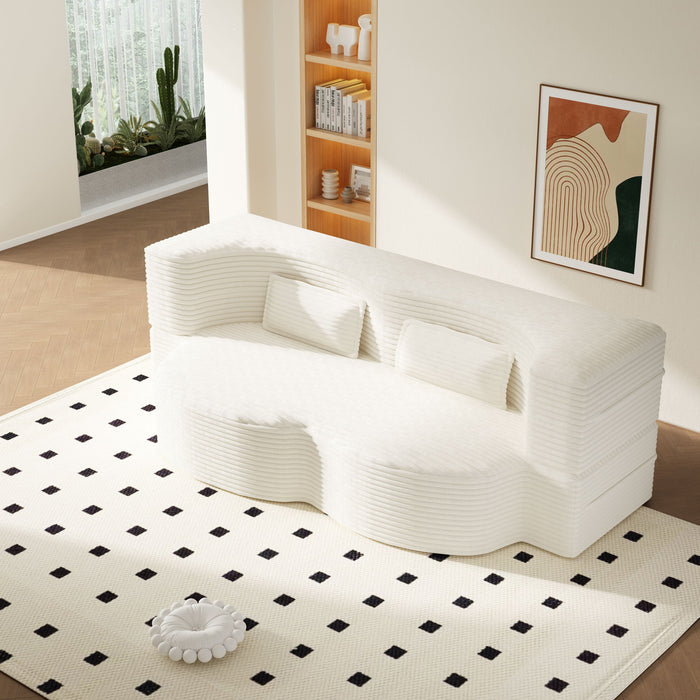 Giga floor sofa with two pillows and a convertible twin-size mattress, ideal for living room seating and lounging.