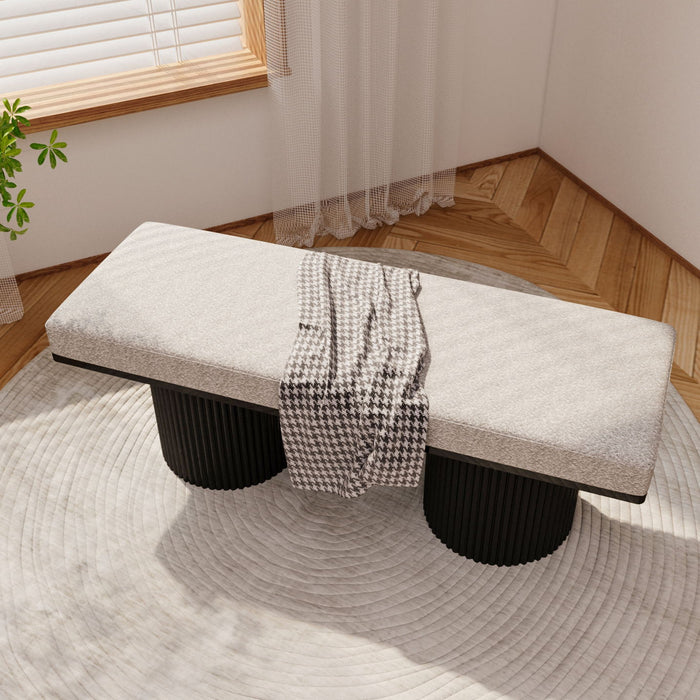 Light gray upholstered Giga bench with black chunky legs, featuring boucle fabric, ideal for bedroom or living room decor.