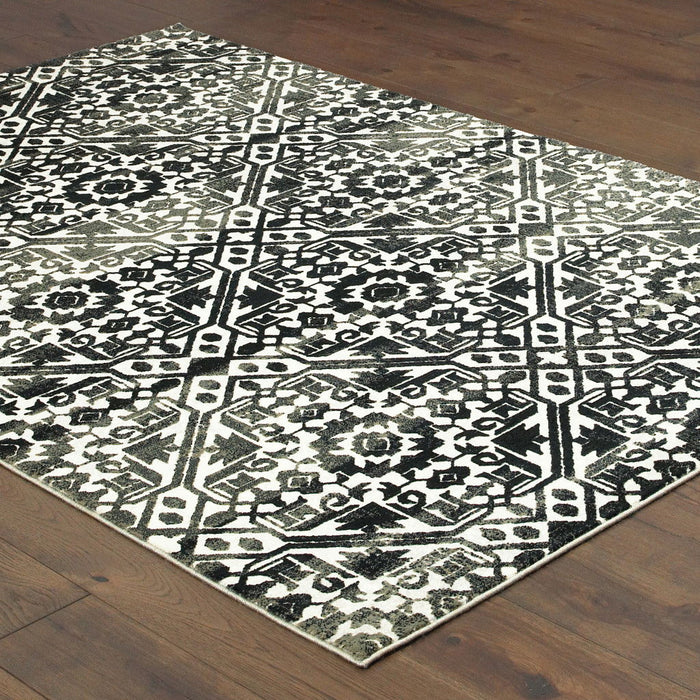 8' x 11' Geometric Power Loom Stain Resistant Area Rug - Navy And Ivory