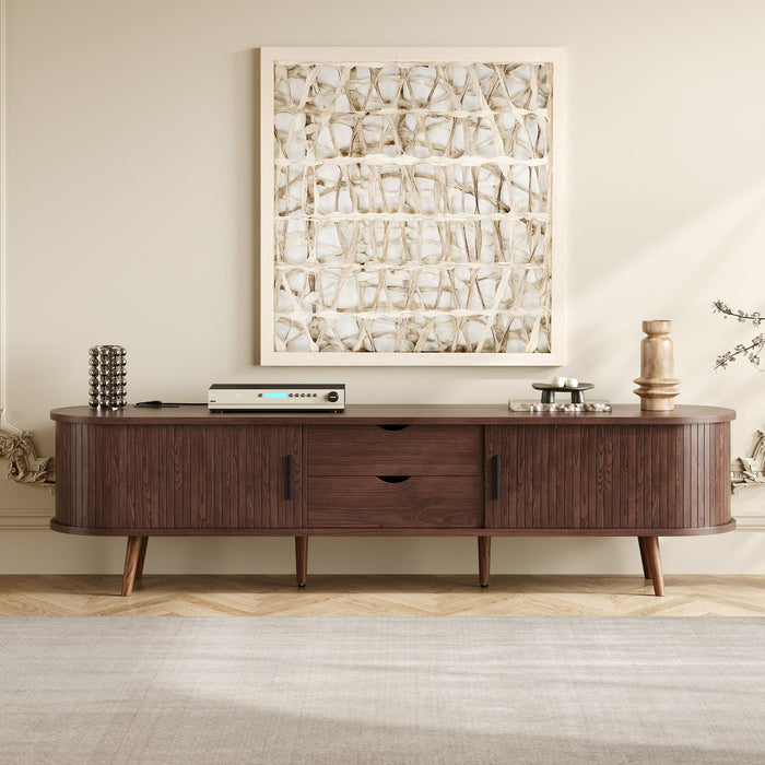 Dark brown Giga TV stand for 70-inch TVs with tambour doors, drawers, and built-in power outlet, showcasing modern living room style.