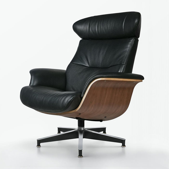 Black tufted genuine leather lounge chair and ottoman with walnut accents, stainless steel frame, and modern stationary design.