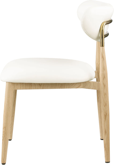 Vegan leather upholstered dining side chair with natural wood legs by Meridian Furniture, showcasing a modern, comfortable design.
