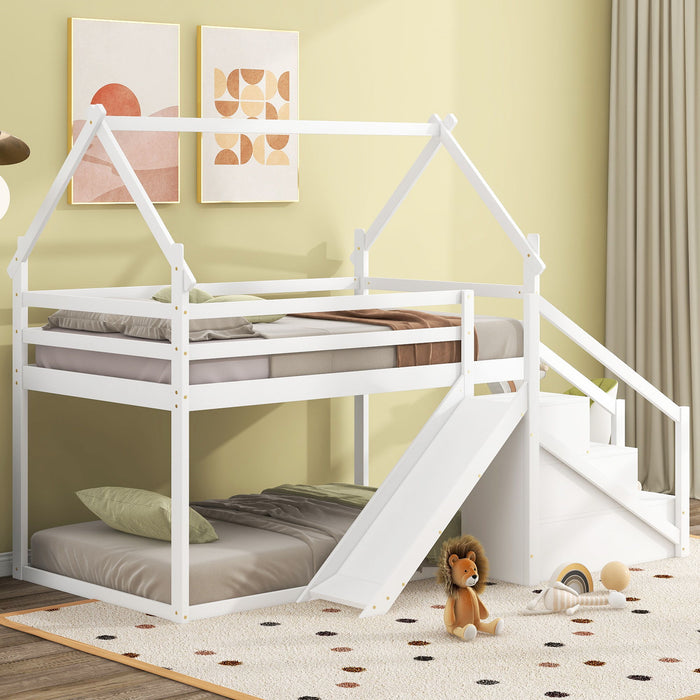 Giga twin over twin house bunk bed with slide, staircase, and playhouse design, made of wood in a children's bedroom.