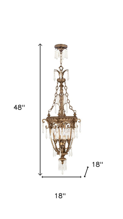 Gold metal chandelier with four clear glass shades and dimmable lighting, designed by HomeRoots for elegant illumination.