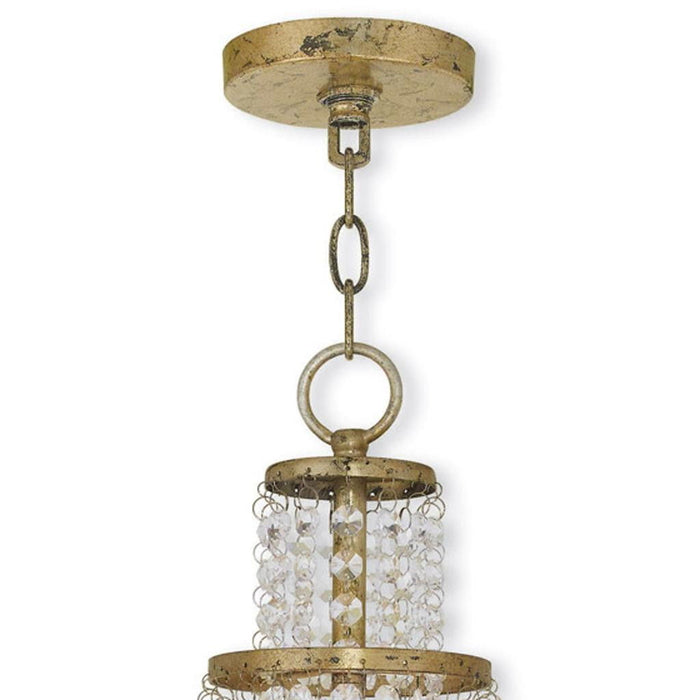 HomeRoots 20-inch three-light metal chandelier with shades, featuring a gold finish and clear and off-white shades.