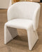 Set of two gray upholstered dining arm chairs by Signature Design by Ashley®, featuring padded seats and stylish wooden legs.