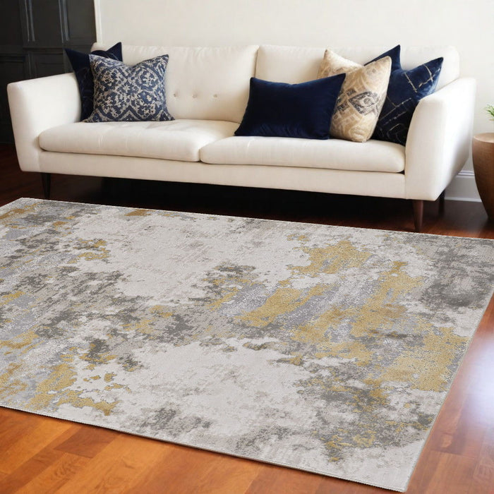 8' x 11' Abstract Stain Resistant Area Rug - Ivory Gold And Gray