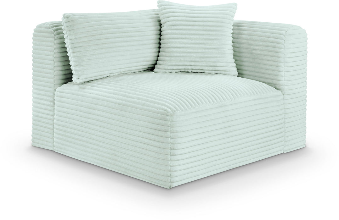 Meridian Furniture Shaggy corner chair with plush fabric, designed for cozy seating in modern living spaces.