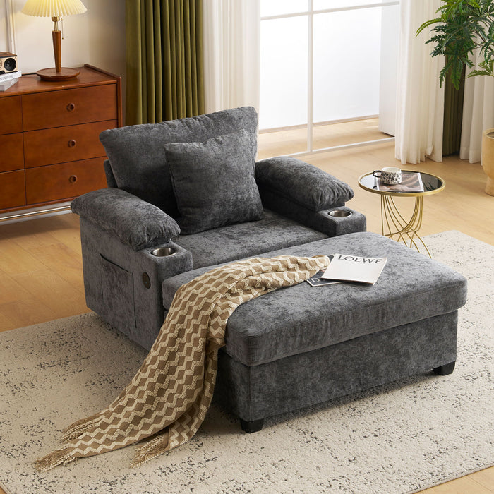 Giga modern oversized stationary chair with matching ottoman, built-in cupholders and USB charging ports, neutral fabric upholstery.