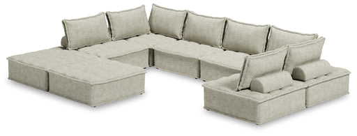 Ashley Furniture Bales 8-Piece Stationary Sectional sofa set with beige fabric and plush cushions in a modern living room setting.