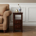 Dark brown manufactured wood end table with two drawers and a shelf, ideal for living room or bedroom decor.