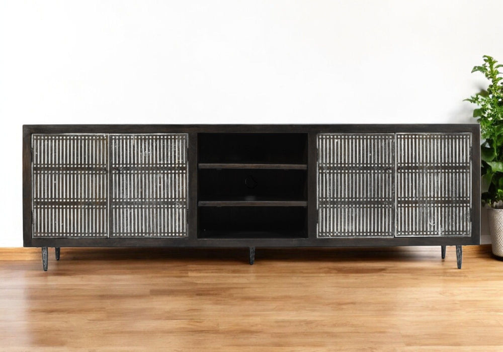 Dark brown 92-inch carved geometric distressed wood TV stand with open and enclosed storage compartments by HomeRoots.