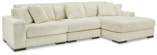 Ashley Furniture Lindyn 3-piece stationary sectional with plush cushions and modern design, perfect for living room relaxation.