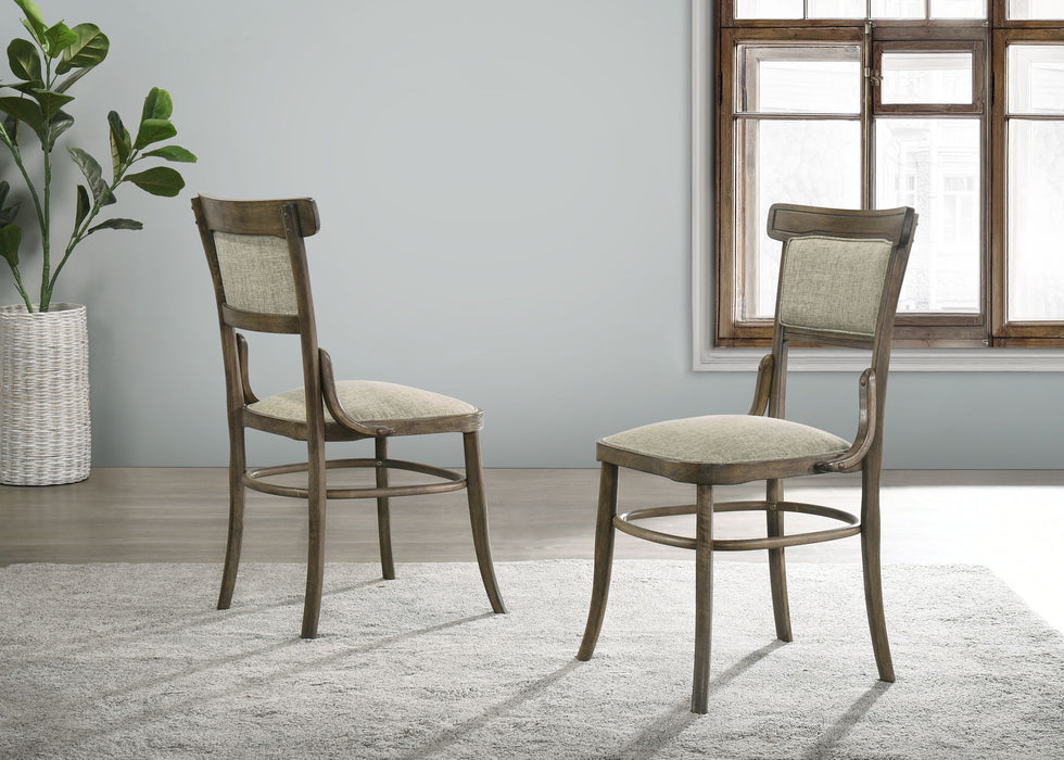 Set of two vintage walnut Giga Bistro wide dining chairs with cushioned seats and curved backrests.