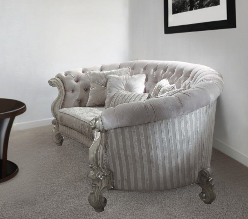 Ivory velvet curved floral sofa with gray legs and matching toss pillows, stationary home furniture by HomeRoots