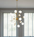 HomeRoots Sputnik multi-light chandelier with frosted glass shades, gold metal frame, and dimmable functionality.