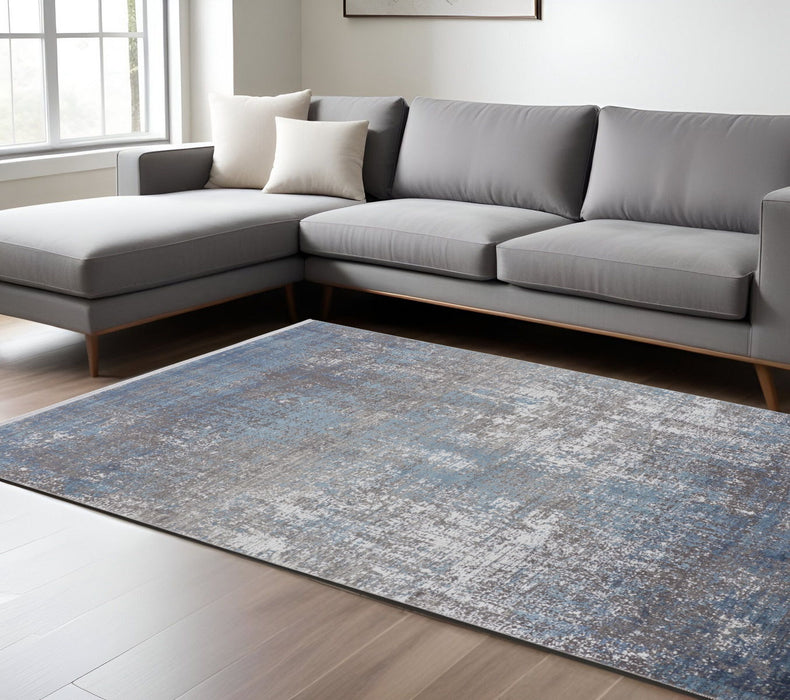 7' x 10' Abstract Power Loom Distressed Area Rug With Fringe - Blue Gray And Silver