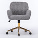 Giga swivel office chair with artificial rabbit hair upholstery, metal base, adjustable height, and rolling caster wheels for home or desk use.