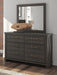 Signature Design by Ashley Vonitta Bay six-drawer dresser in a warm wood finish