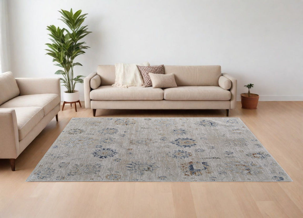 7.8' x 10.3' Floral Power Loom Worn Faded Area Rug With Fringe - Ivory Taupe And Blue