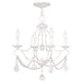 Four-light metal chandelier with antiqued white shades, dimmable lighting, designed by HomeRoots, featuring a classic and elegant style.