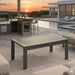 Giga all-weather outdoor coffee table with wood-look top, sturdy design, ideal for patio or garden seating areas.
