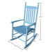 Giga wooden porch rocker chair with curved armrests and slatted backrest, designed for outdoor relaxation on a porch.