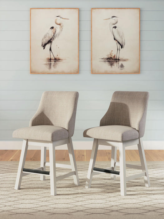 Set of two Robbinsdale upholstered swivel barstools with curved back in antique white by Signature Design Ashley.