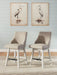 Set of two Robbinsdale upholstered swivel barstools with curved back in antique white by Signature Design Ashley.