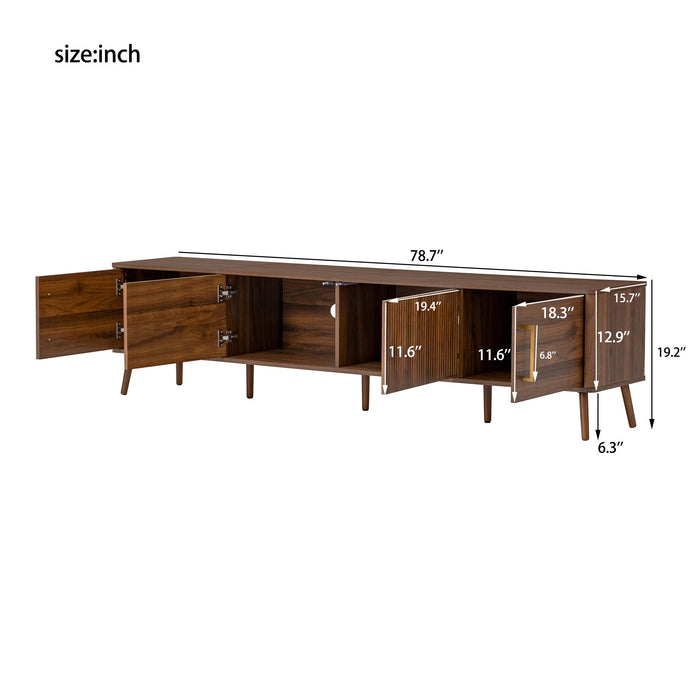 Giga walnut TV stand for TVs up to 85 inches with fluted door, cable management, and soft-closing hinges.