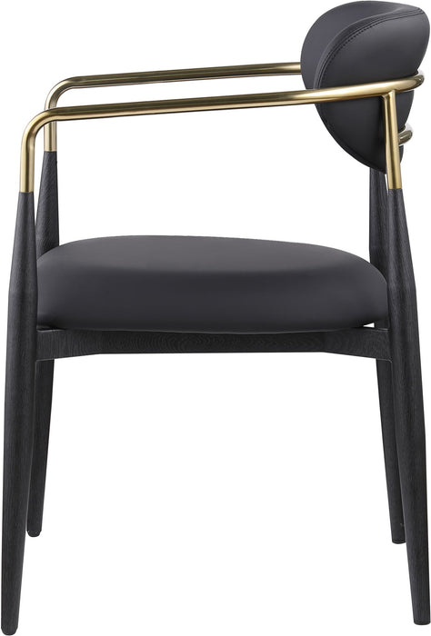 Black-legged Ronda vegan leather upholstered dining arm chair by Meridian Furniture with modern design and cushioned seat.
