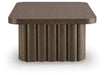 Rectangular Cocktail Table from Darimore by Signature Design by Ashley® with a sleek wooden surface and sturdy legs.