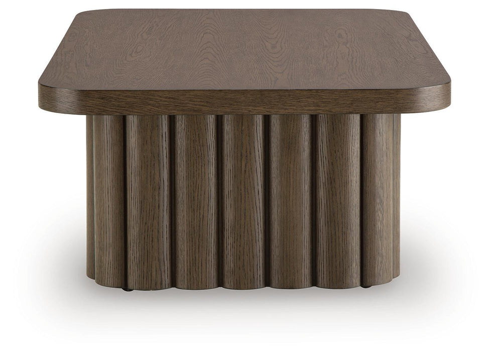 Rectangular Cocktail Table from Darimore by Signature Design by Ashley® with a sleek wooden surface and sturdy legs.