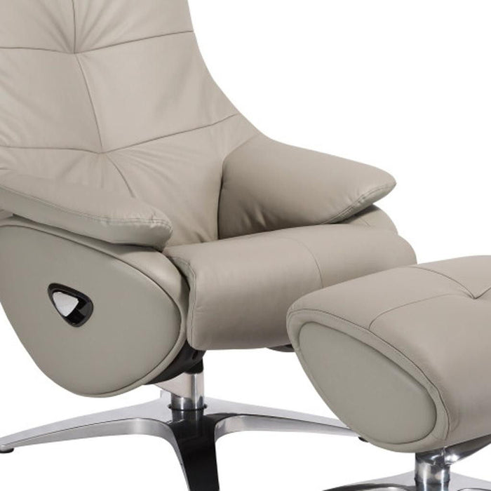 Gray tufted genuine leather manual swivel recliner with matching ottoman, featuring plush cushioning and sturdy metal base for comfort.