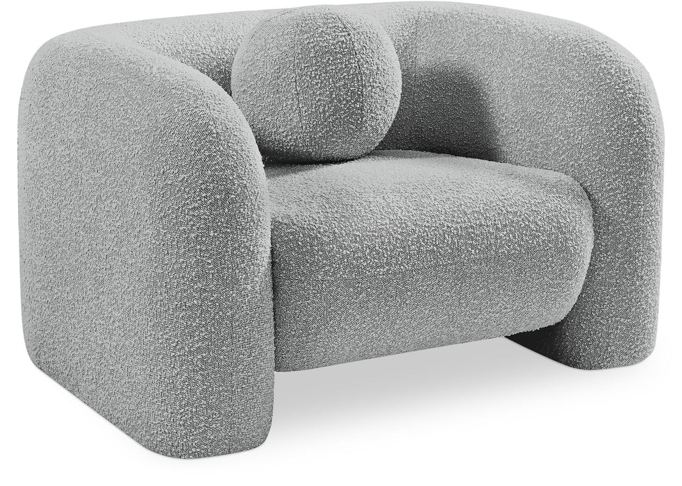 Modern Emory arm chair by Meridian Furniture with plush upholstery and sleek wooden legs, ideal for living room or office decor.