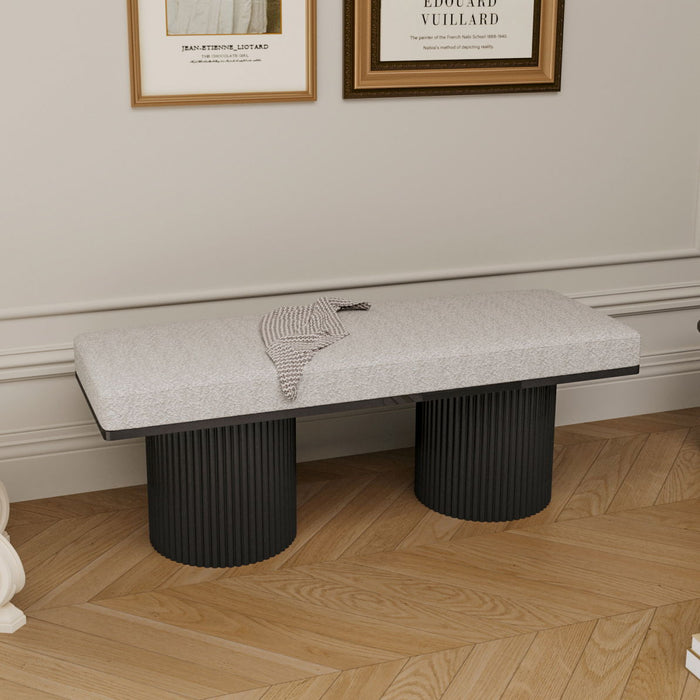 Light gray upholstered Giga bench with black chunky legs, contemporary bed-end or living room accent, featuring boucle fabric.