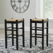 Set of two Ashley Furniture Mirimyn tall stools with wooden legs and upholstered seats, ideal for kitchen or bar areas.