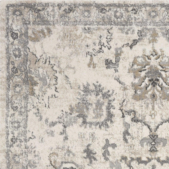 9' x 13' Machine Woven Distressed Floral Traditional Indoor Area Rug - Ivory