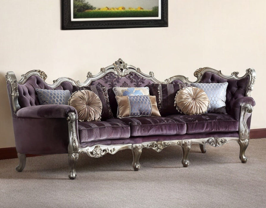 Dark purple velvet curved sofa with striped upholstery, platinum legs, and matching toss pillows by HomeRoots.