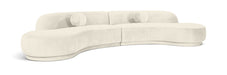 Meridian Furniture Avra 146-inch velvet upholstered sectional sofa with plush cushions and a modern stationary design.