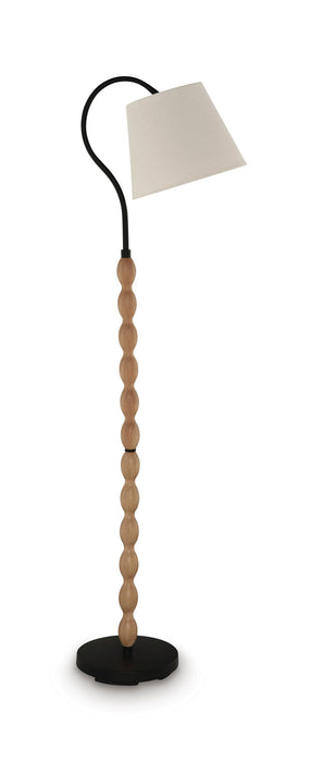 Corinwell wood floor lamp by Signature Design Ashley with a brown and black finish, featuring a tall, modern design with a fabric shade.