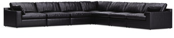 Signature Design by Ashley Emilia stationary sectional with plush cushions and modern fabric upholstery in a stylish living room setting.